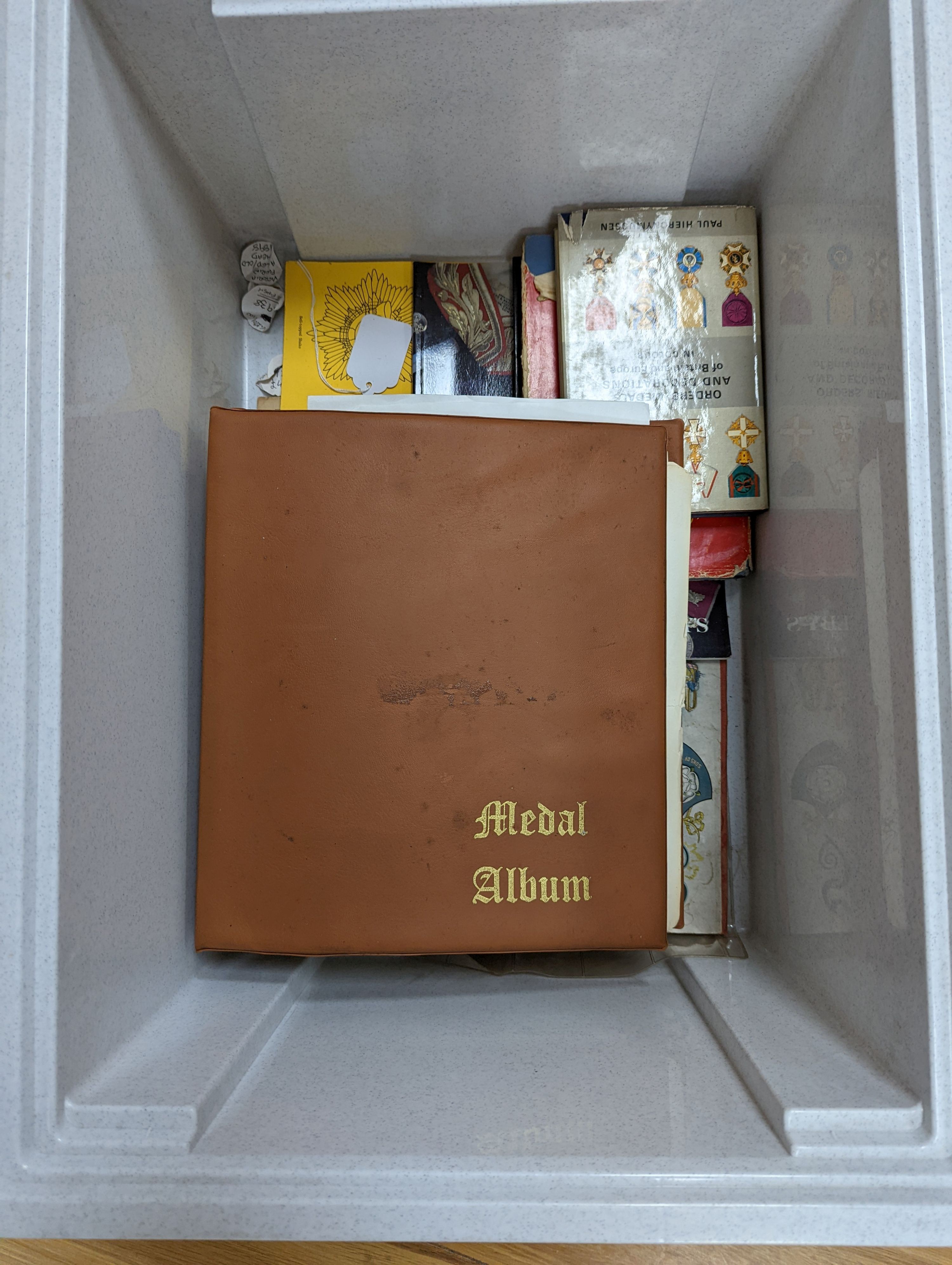 A George VI Territorial For Efficient Service medal, ARP, On War Service, Women’s Land Army badges, UN medal and other badges and medals and a quantity of reference books